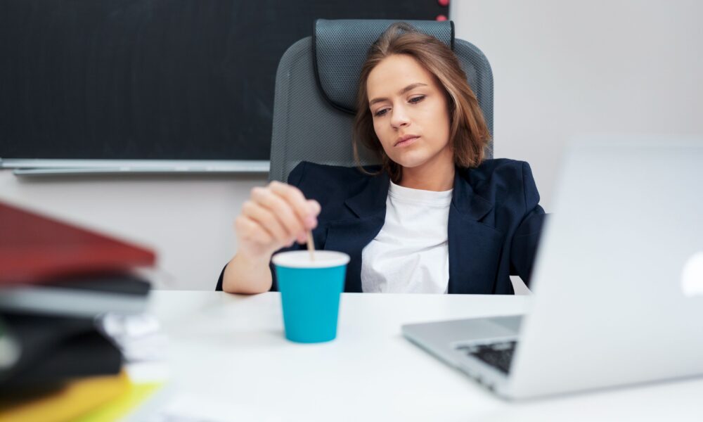 Professional sitting quietly after work feeling mentally exhausted despite completing daily responsibilities