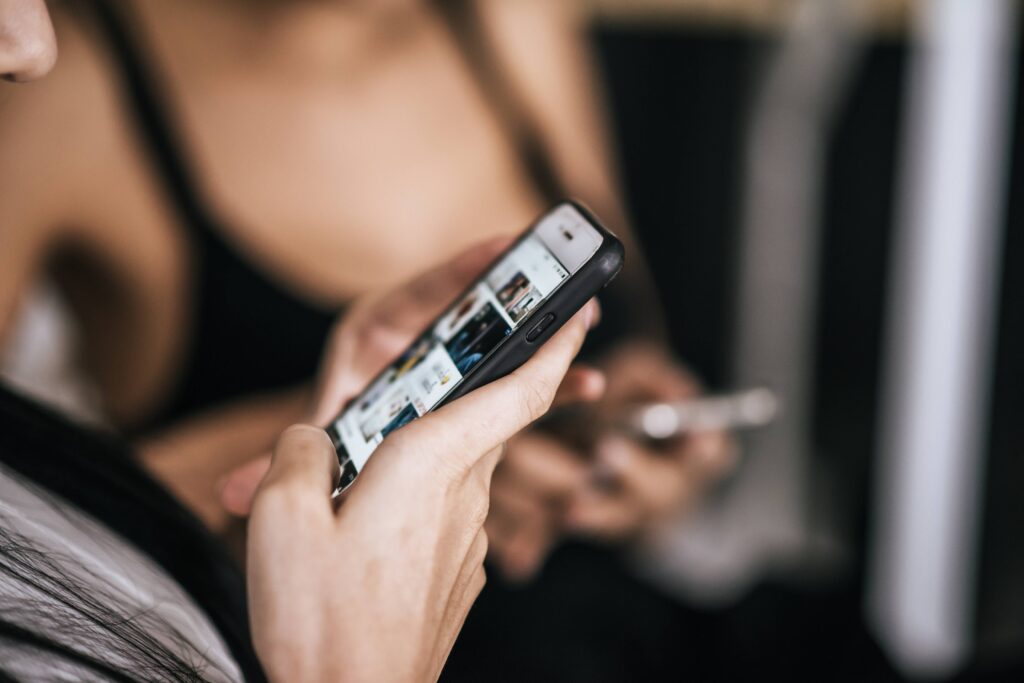 Person switching between different types of content while scrolling on a smartphone