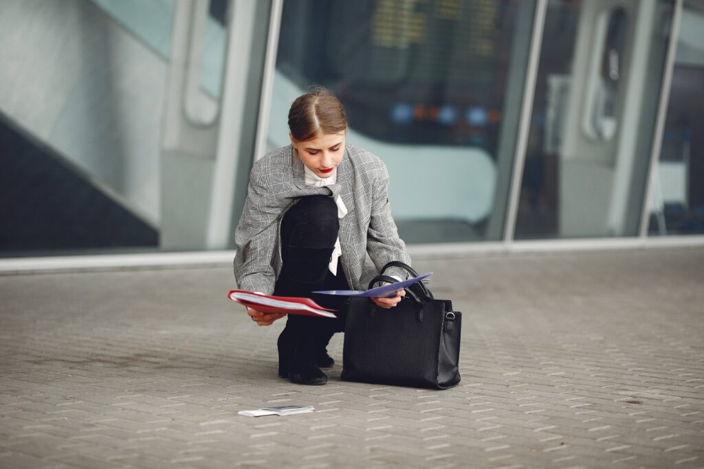 Person carrying a heavy backpack as a visual metaphor for accumulated emotional stress
