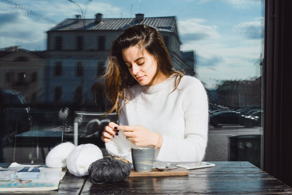 Woman putting her smartphone away and taking a quiet mental break