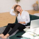 Person sitting quietly after feeling overwhelmed by stress while taking a moment to regain control