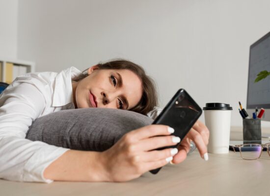 Woman feeling mentally tired after scrolling on her smartphone