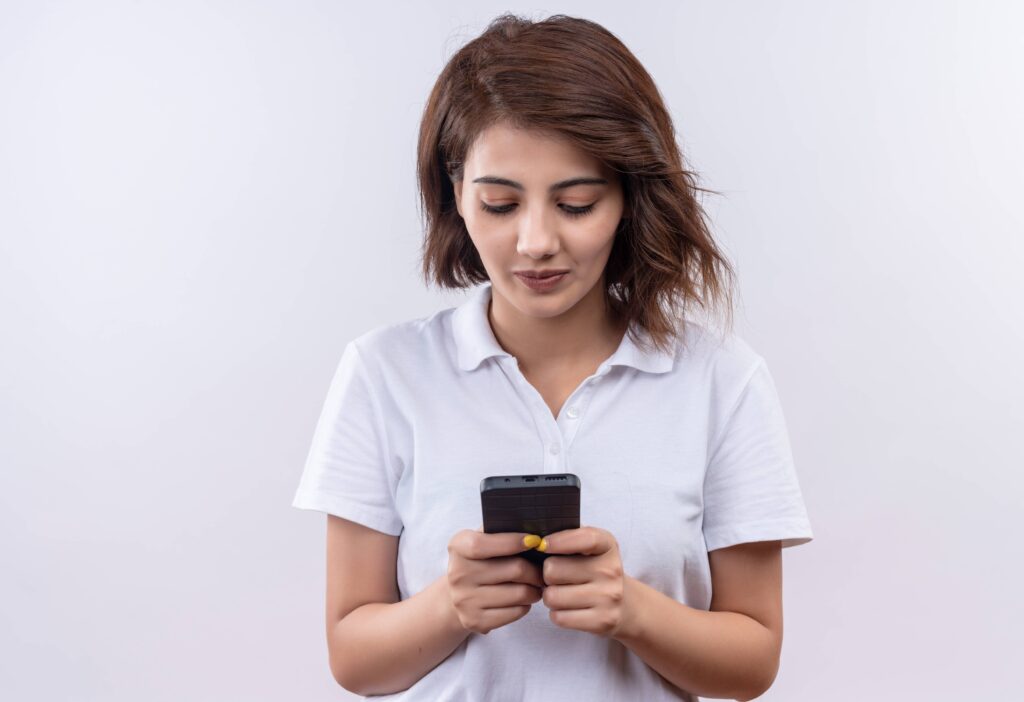 Person reviewing smartphone notification settings to reduce unnecessary digital distractions
