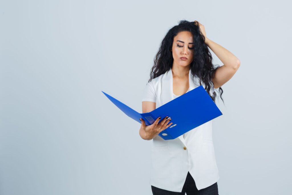 Professional overwhelmed by racing thoughts while looking at an overflowing to-do list