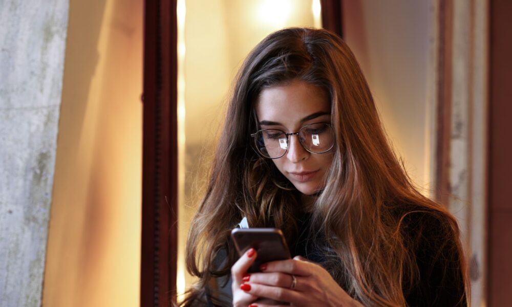 Woman reflecting on her relationship with digital technology