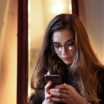 Woman reflecting on her relationship with digital technology