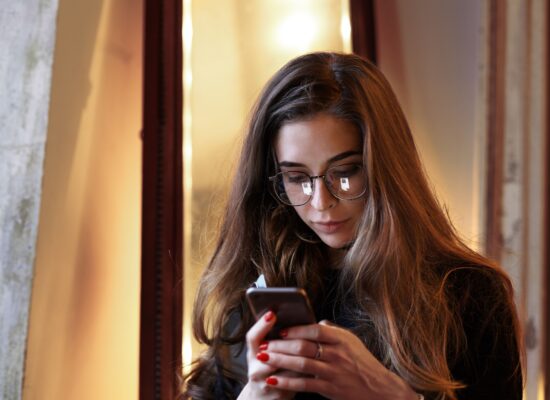 Woman reflecting on her relationship with digital technology